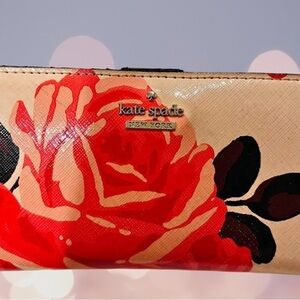 Kate Spade floral design wallet. Condition preowned.